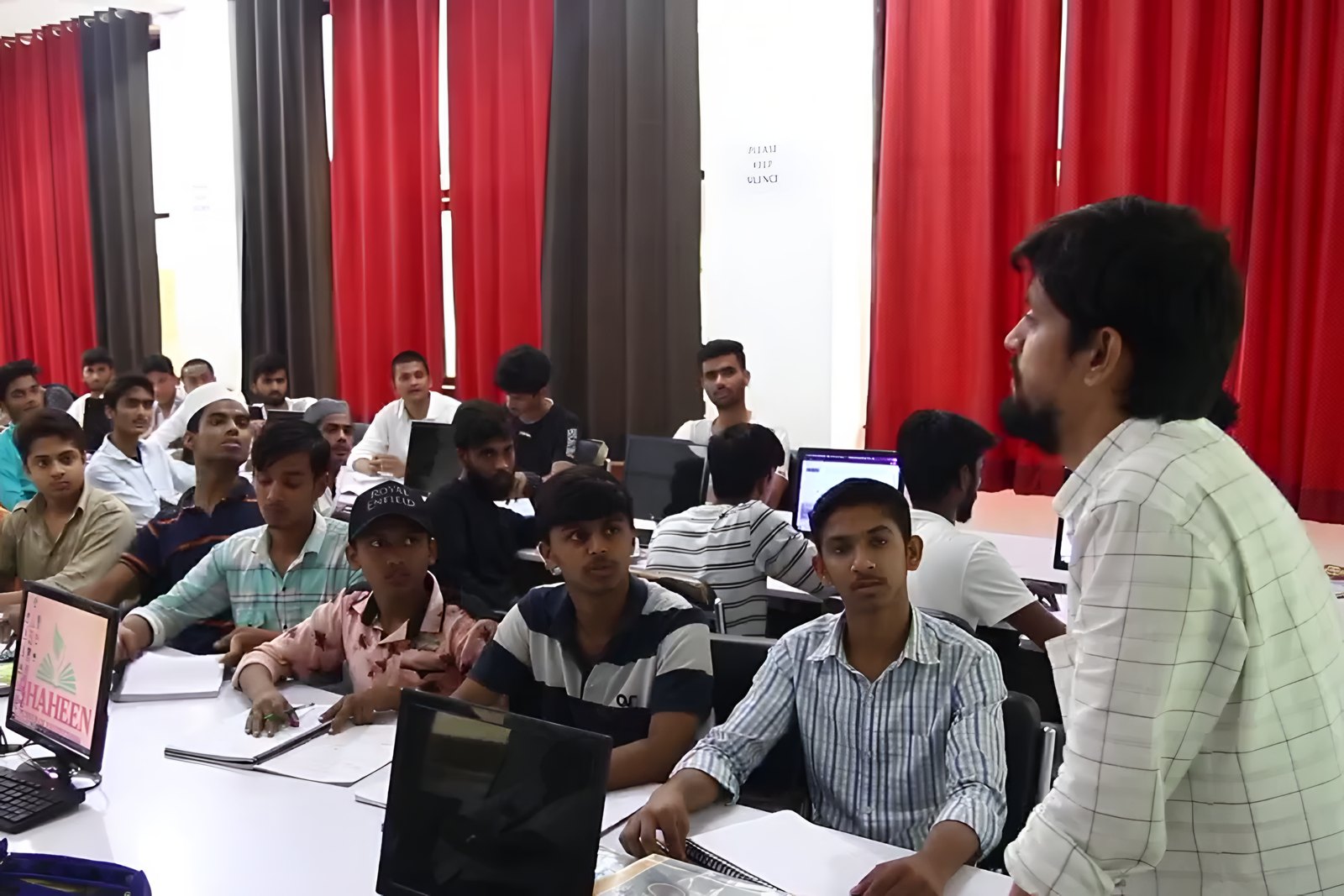 Students working in groups in a study room